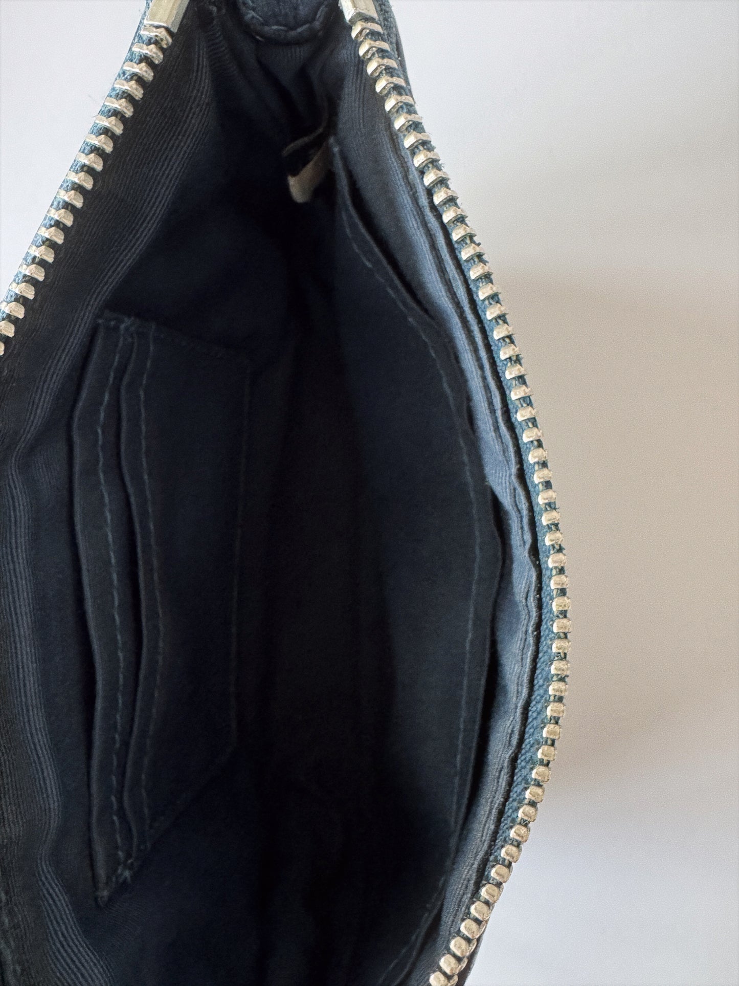 small blue coach handbag inside