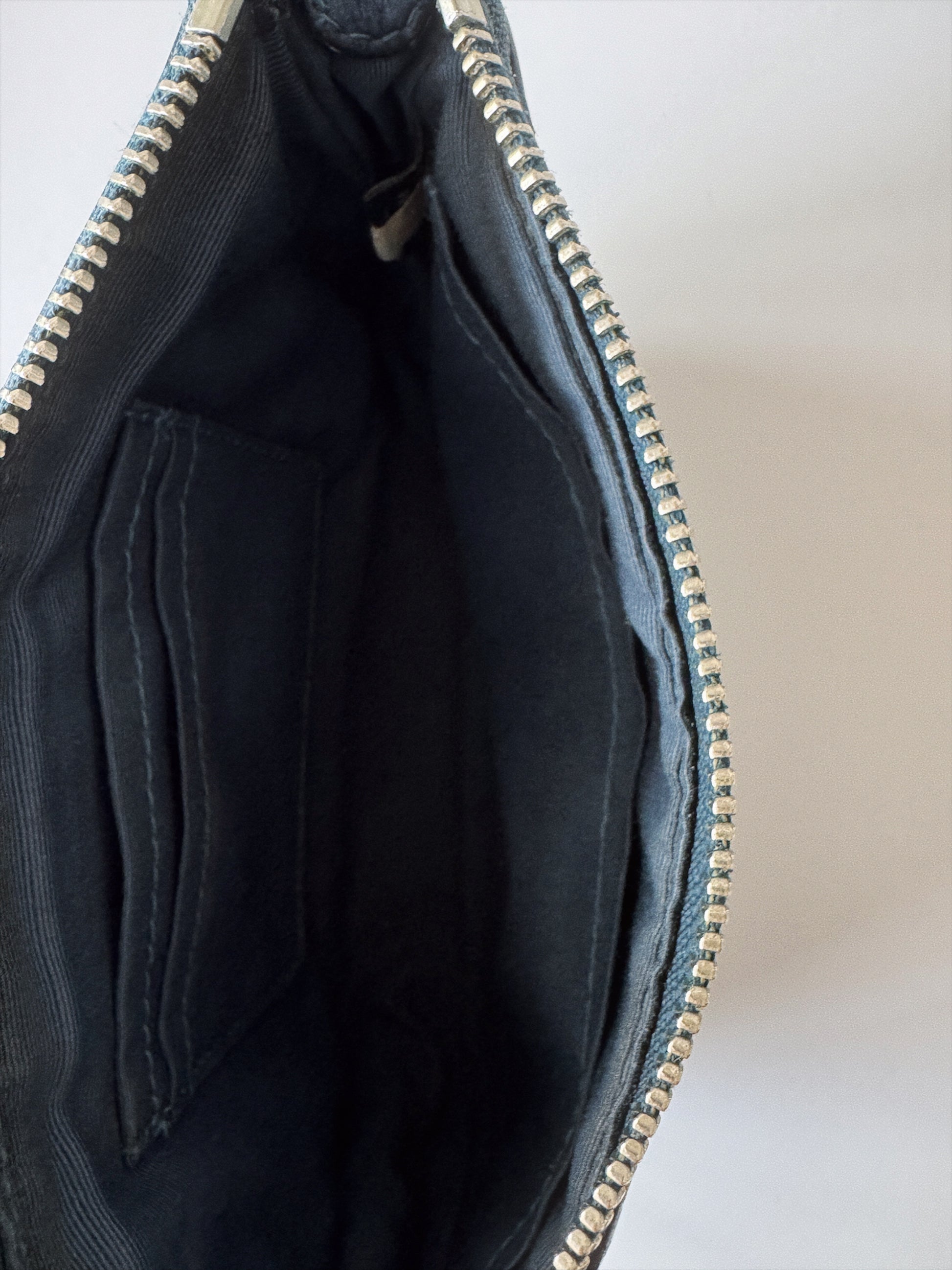 small blue coach handbag inside