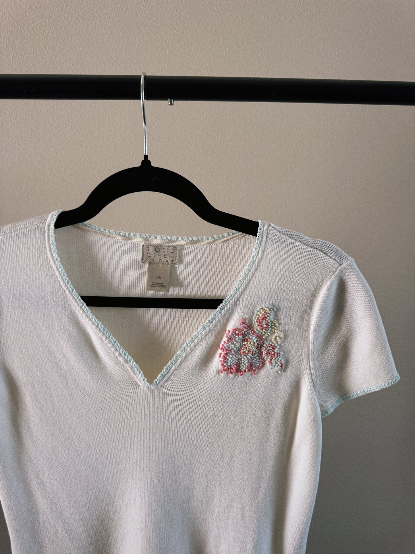 white v neck tee with embroidered detail