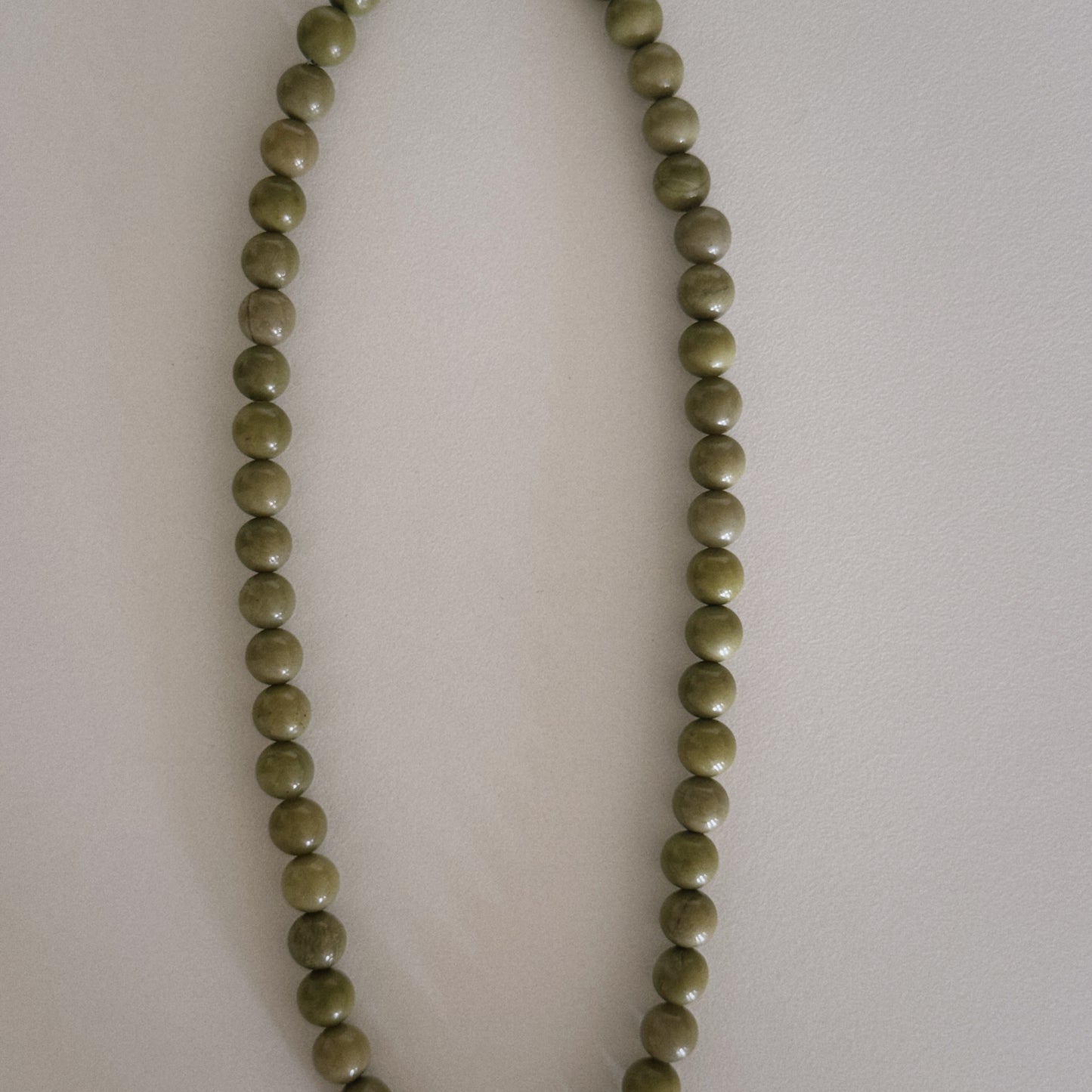 avocado beaded necklace with oyster pendant