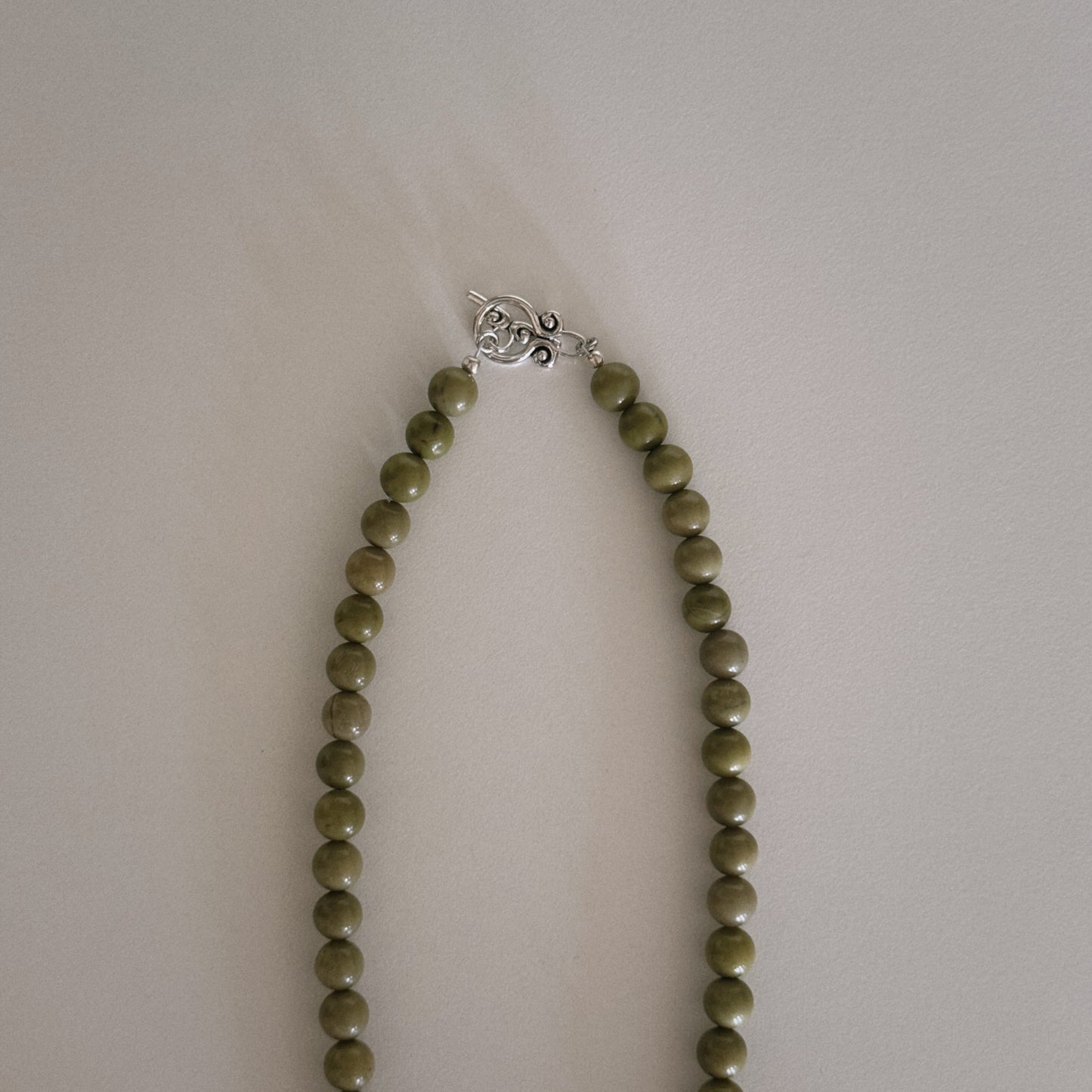 avocado beaded necklace with oyster pendant