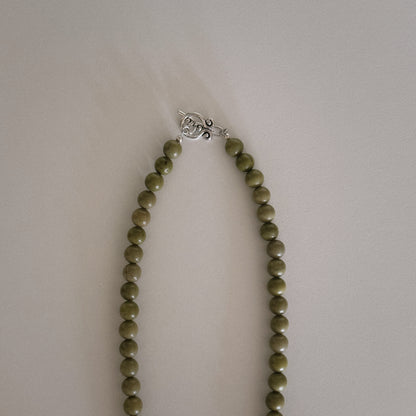 avocado beaded necklace with oyster pendant