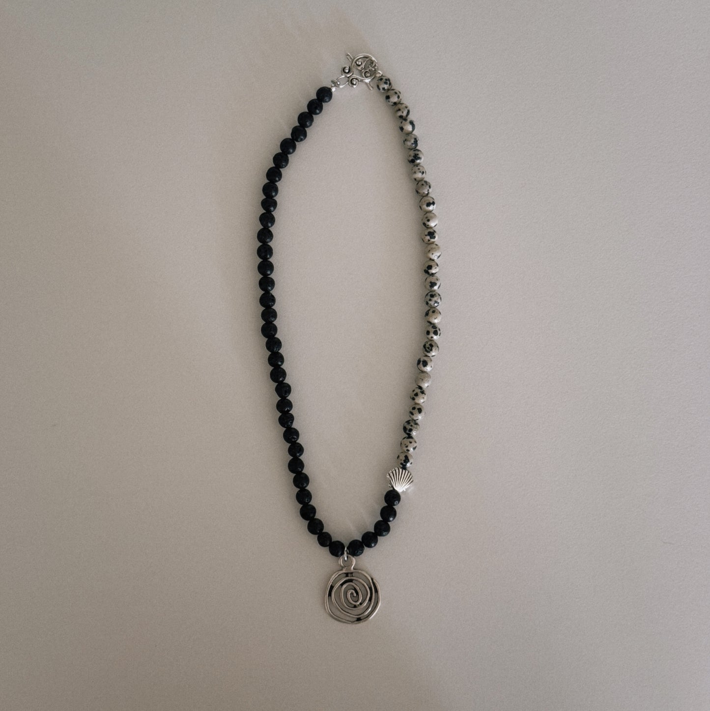 black lava & dalmation beaded necklace with spiral pendant