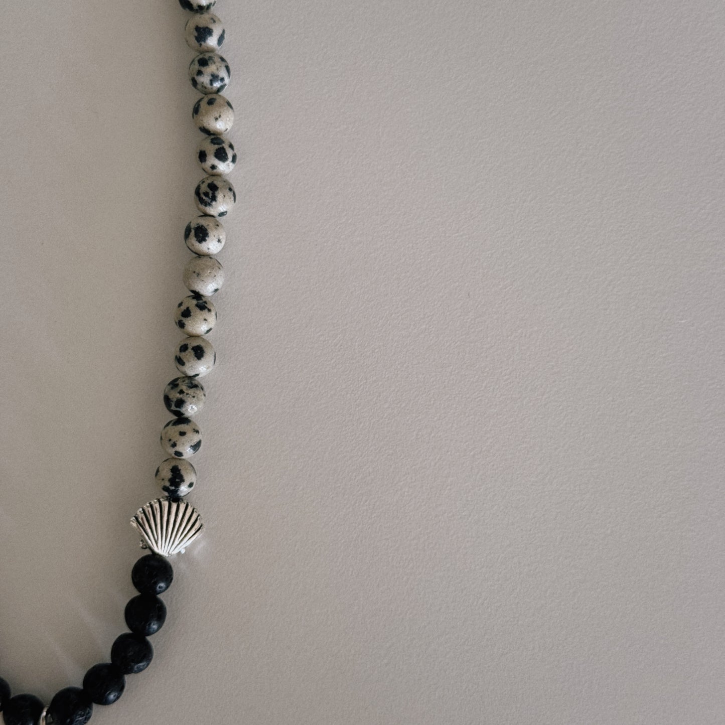 black lava & dalmation beaded necklace with spiral pendant