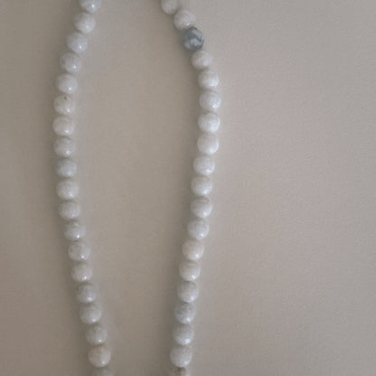 pale blue beaded necklace with mother of pearl shell