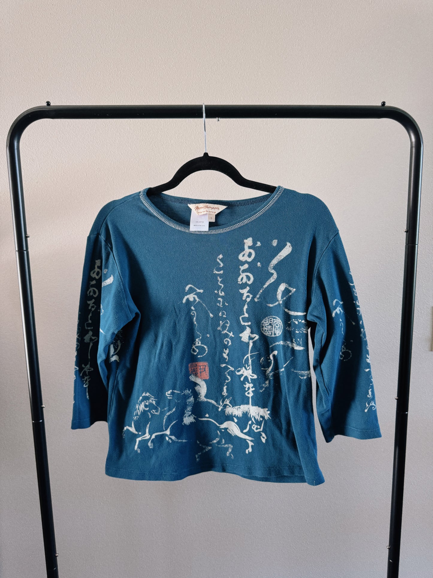 teal calligraphy top