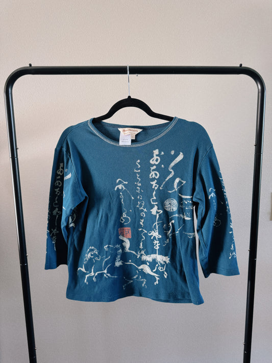 teal calligraphy top