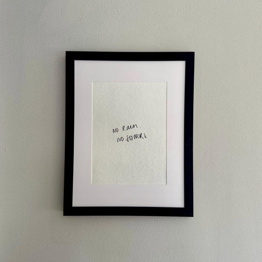 Framed No Rain, No Flowers wall art print on white handmade paper