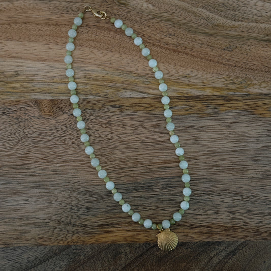 green and blue glass beaded necklace with brass seashell charm and 18k gold filled lobster clasp