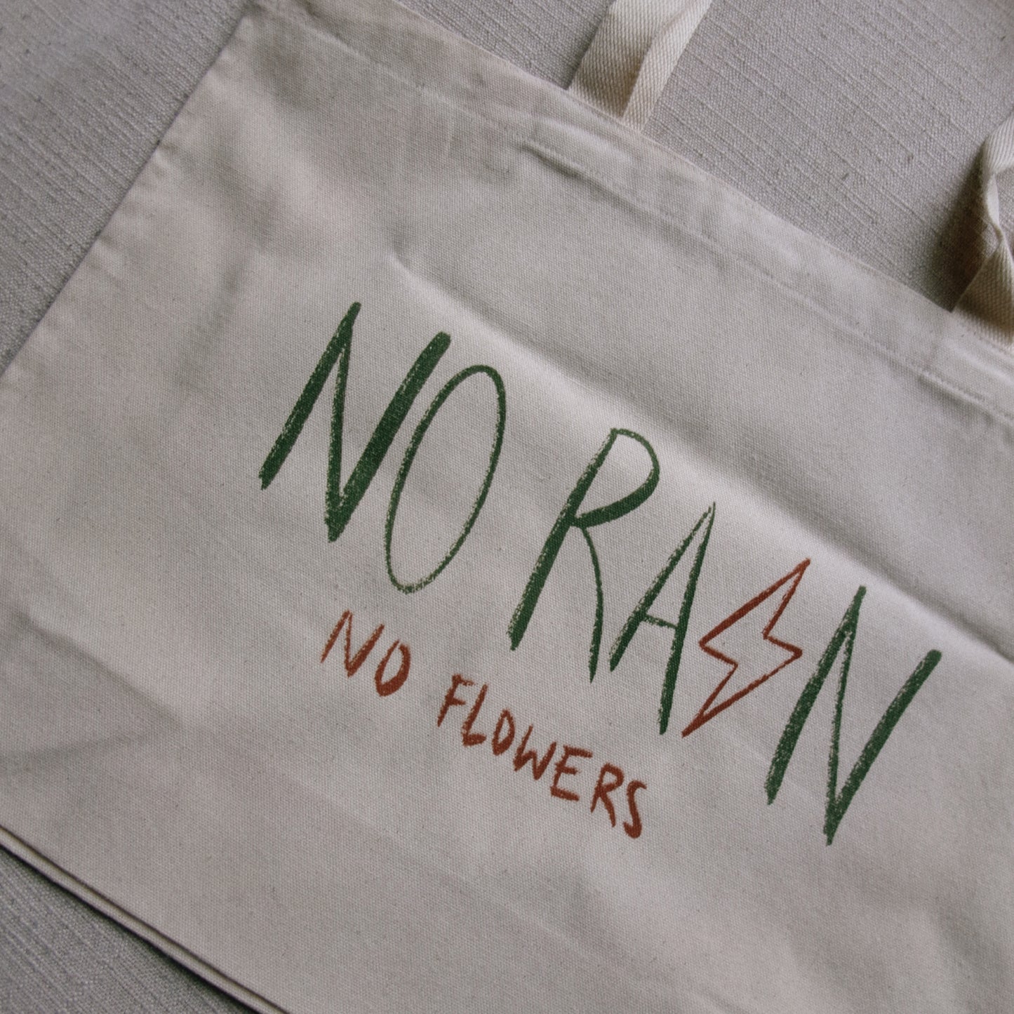 no rain, no flowers tote bag