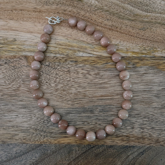 large glass pink beaded necklace with silver antique clasp