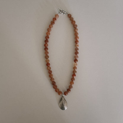 pink sunstone beaded necklace with oyster pendant