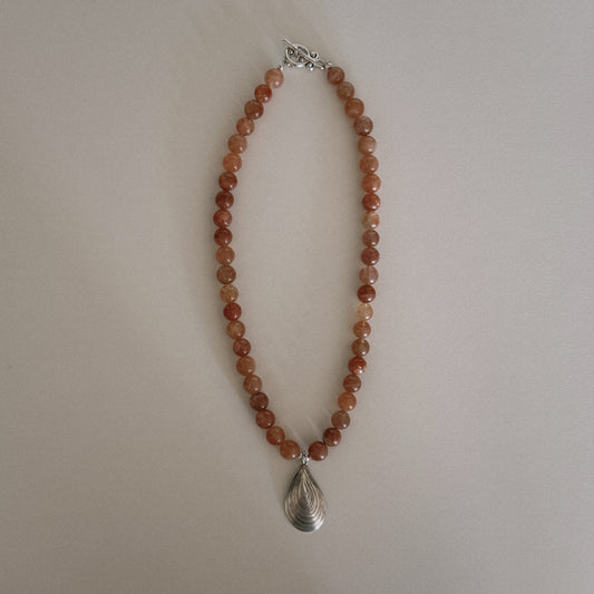pink sunstone beaded necklace with oyster pendant
