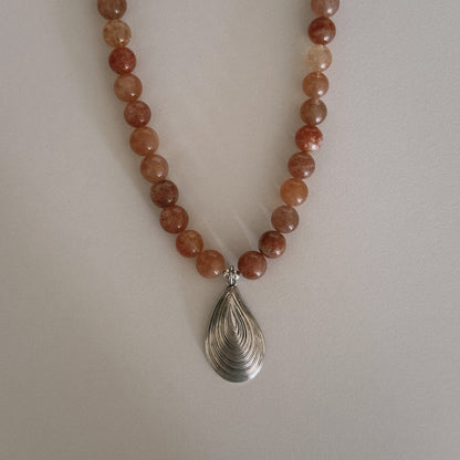 pink sunstone beaded necklace with oyster pendant