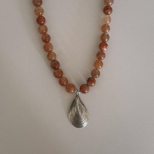 pink sunstone beaded necklace with oyster pendant