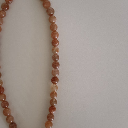 pink sunstone beaded necklace with oyster pendant
