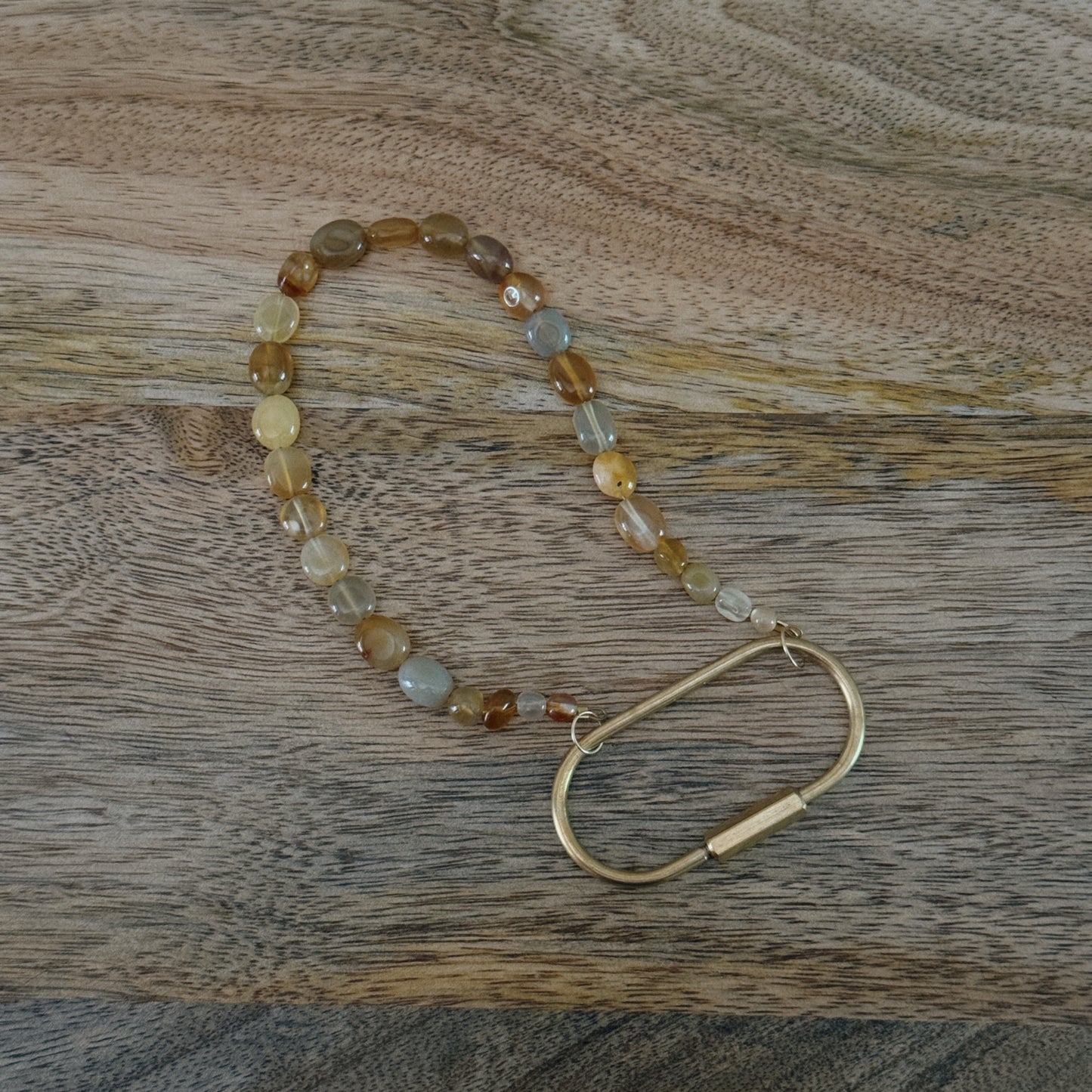 yellow and orange glass beaded keychain with brass carabiner