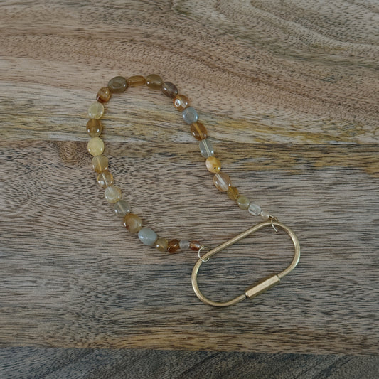 yellow and orange glass beaded keychain with brass carabiner